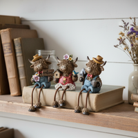 Highland Cow Shelf Sitter with Garden Accessory