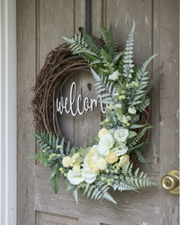 Welcome White Hollyhock and Yellow Ranunculus Fern Wreath