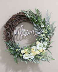 Welcome White Hollyhock and Yellow Ranunculus Fern Wreath