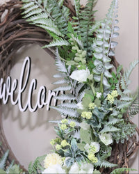 Welcome White Hollyhock and Yellow Ranunculus Fern Wreath