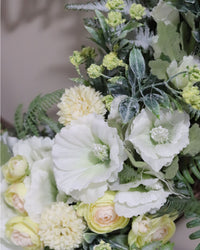 Welcome White Hollyhock and Yellow Ranunculus Fern Wreath
