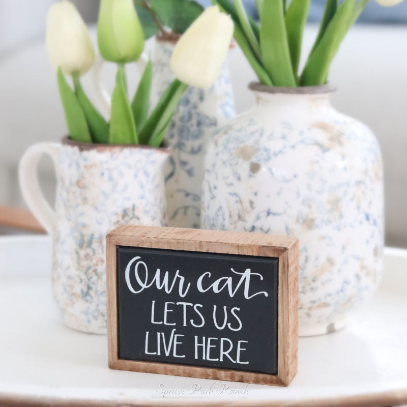 Our Cat Lets Us Live Here Mini Sign